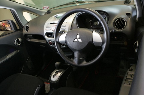 Mitsubishi i-MIEV interior steering wheel and panel view