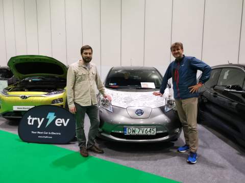 Marek poses with Arkady next to his Nissan LEAF which crossed Africa at the London Motor & Trade Show