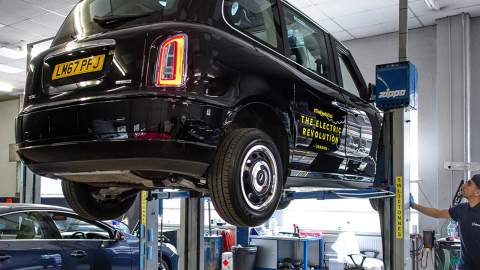 Black cab in a workshop