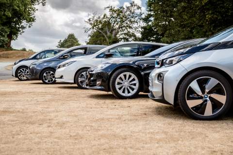 a line up of some electric vehicles