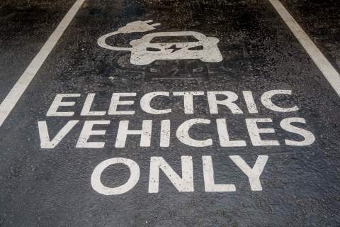 electric vehicles only, written in a parking space