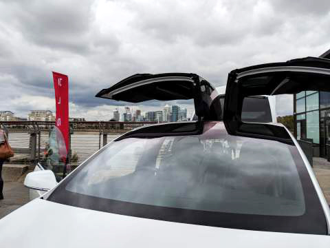 A view of The City through the open doors of the Tesla Model X