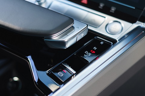 Interior close view on central console (gears control) of an Audi e-tron