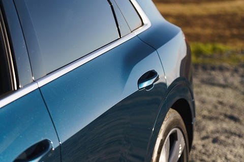 Exterior close view on back passenger-side door of an Audi e-tron