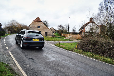 Porsche Cayenne E-Hybrid exterior rear view from distance