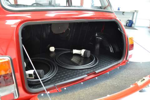 The boot of the Mini with charging cables inside