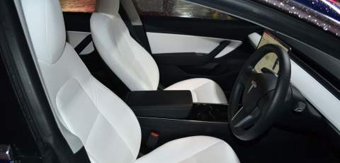 Tesla Model 3 Performance white leather interior rear
